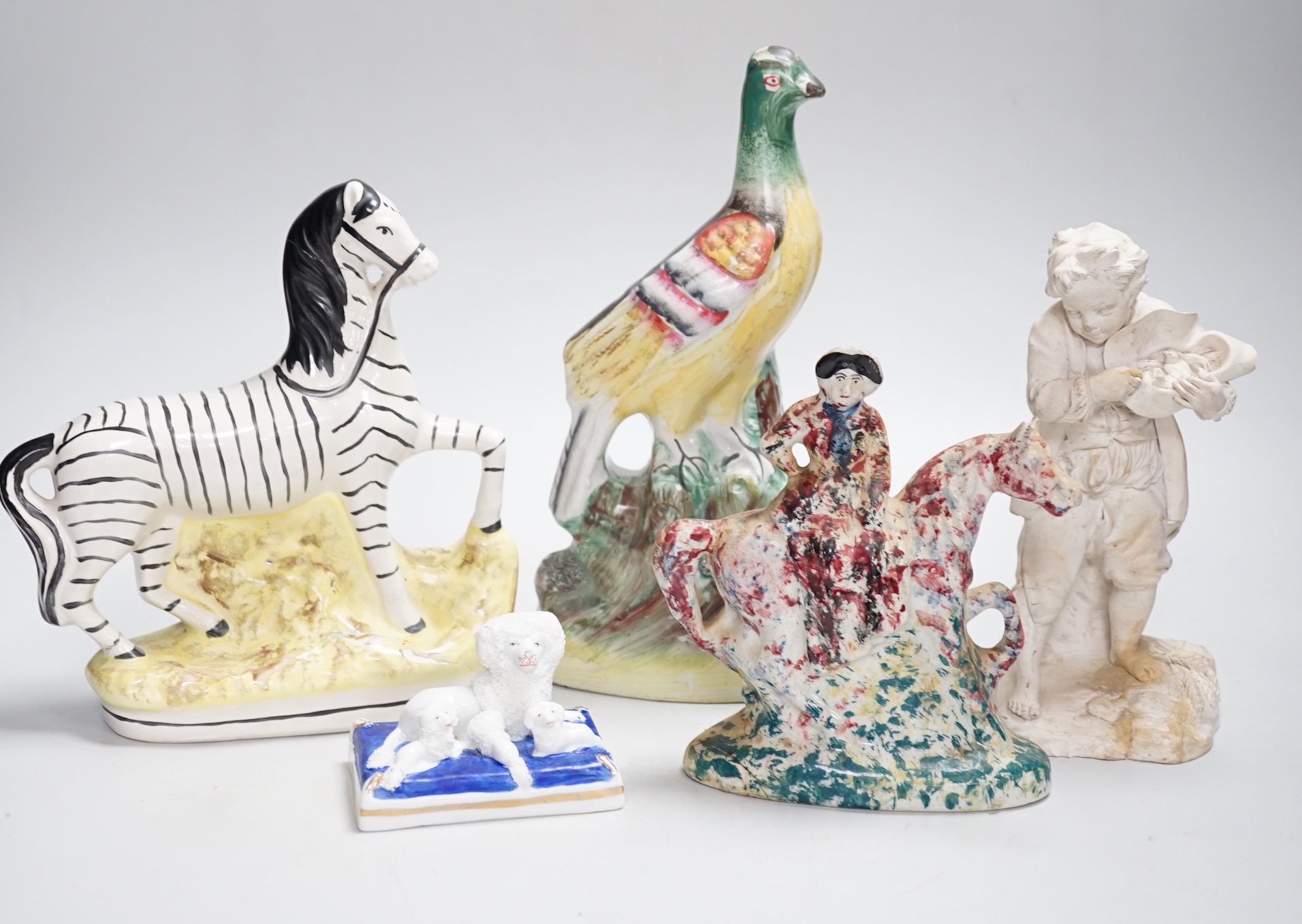 A Staffordshire spongeware rider on horseback, a Staffordshire pheasant, and three other items, pheasant 26cm